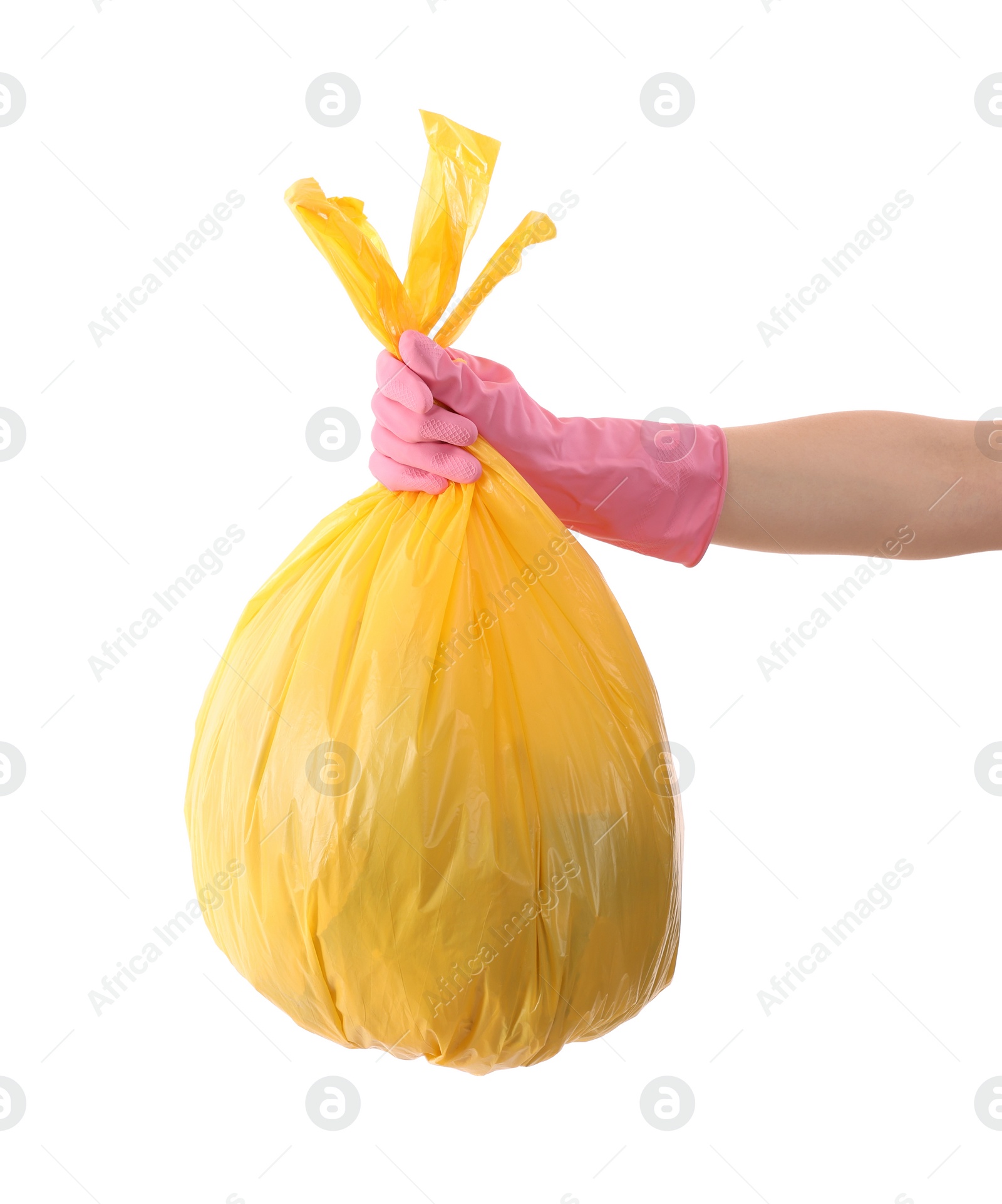 Photo of Woman holding plastic bag full of garbage on white background, closeup