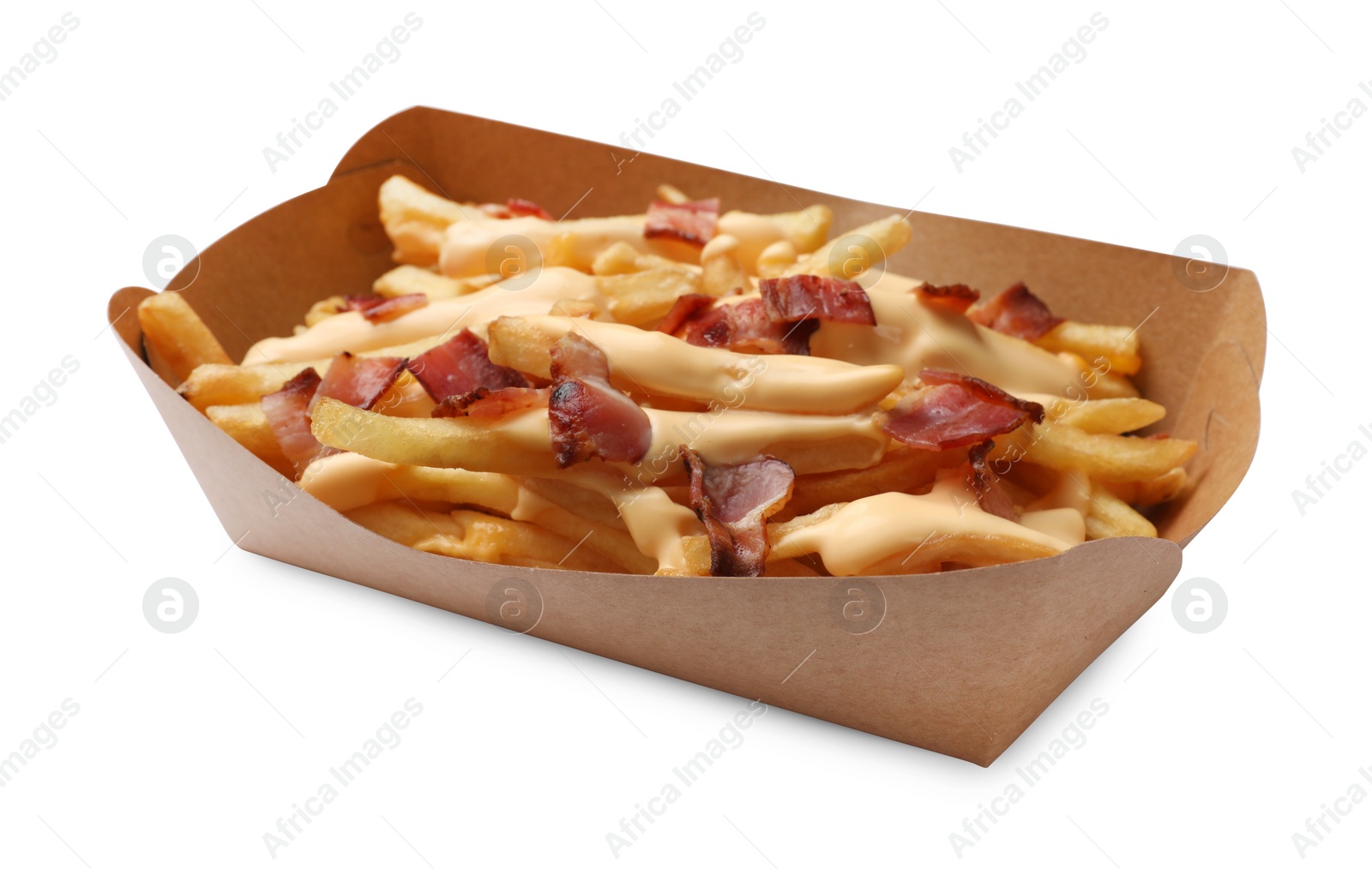 Photo of Tasty potato fries, cheese sauce and bacon in paper container isolated on white