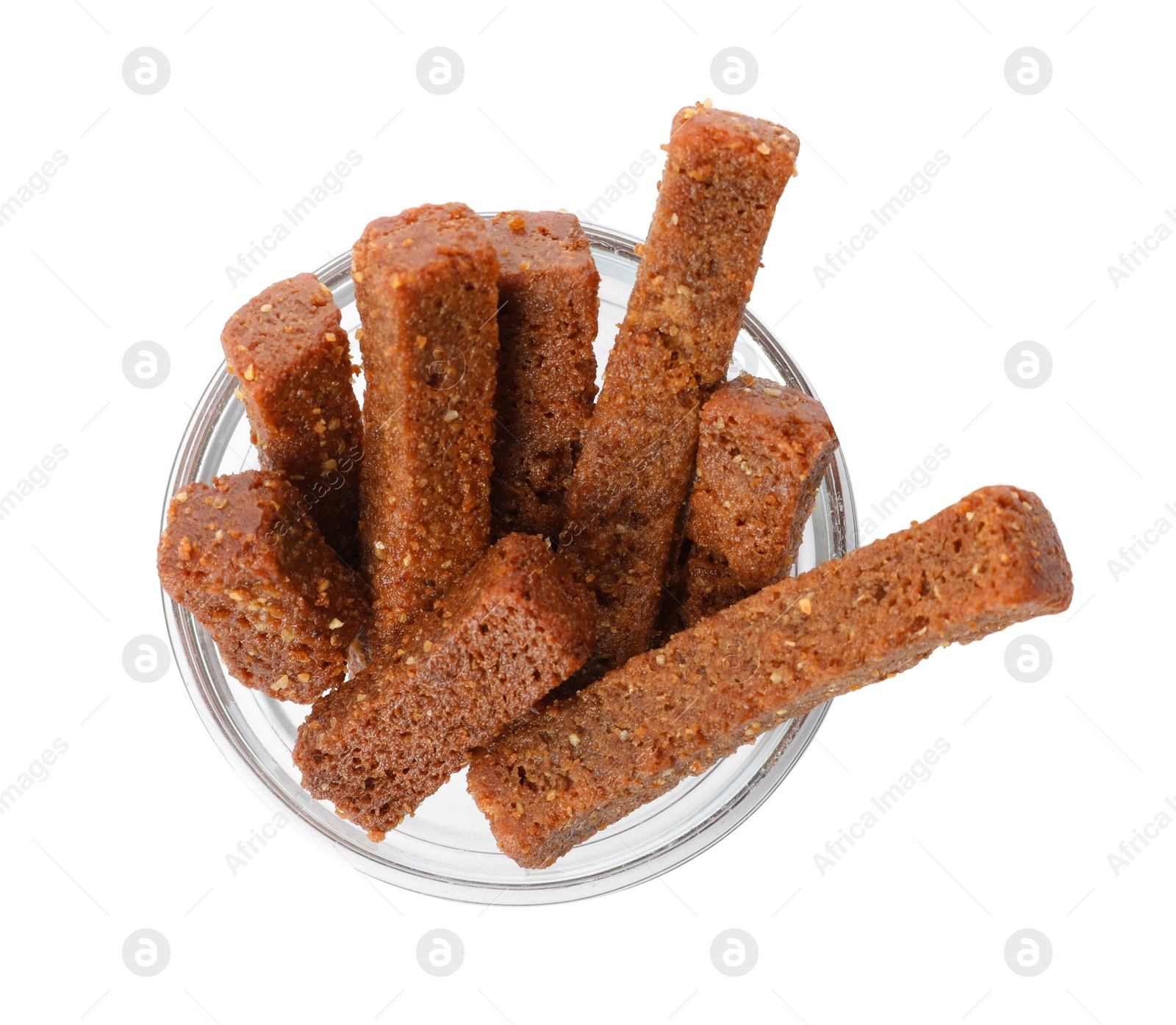 Photo of Crispy rusks in bowl isolated on white, top view