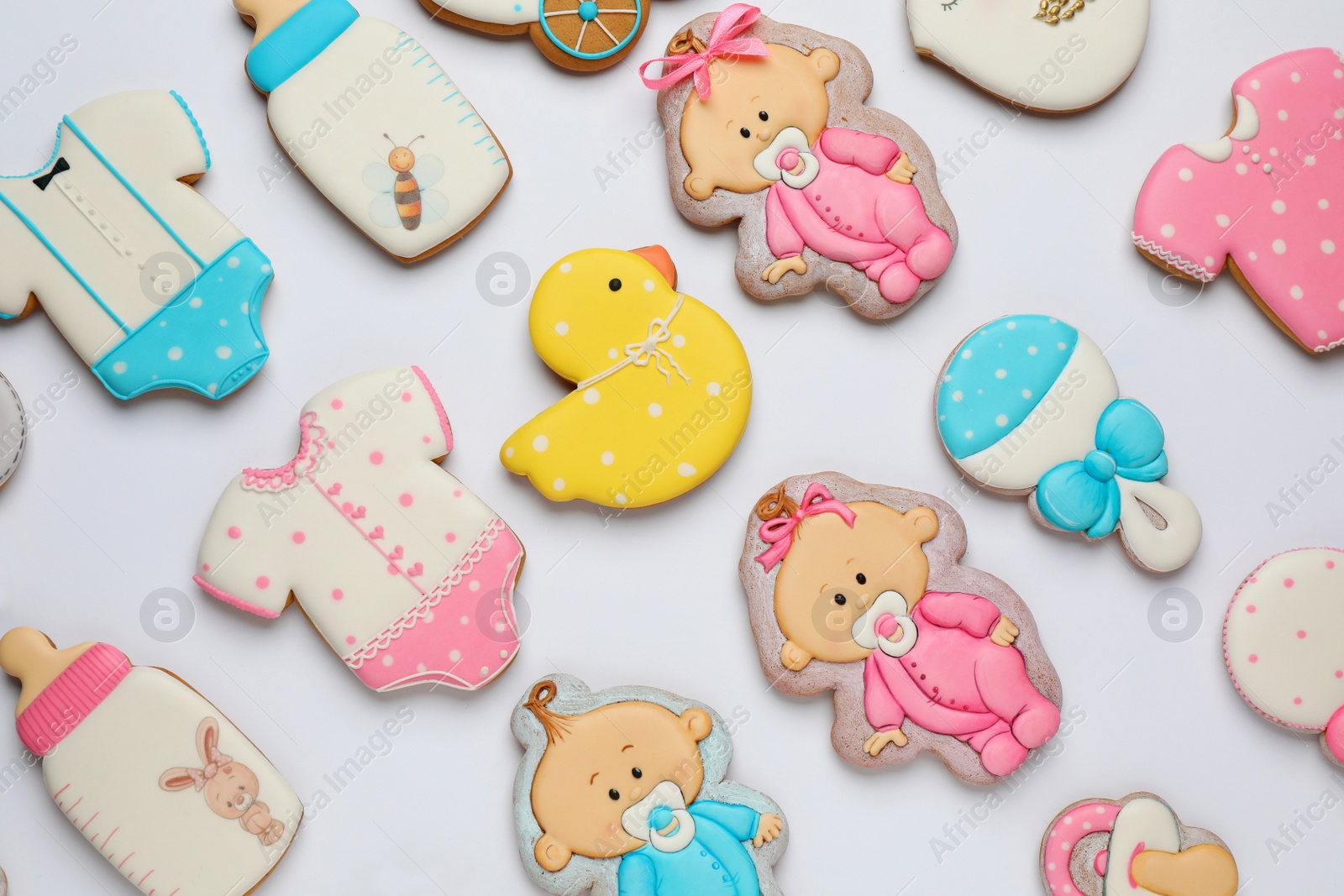 Photo of Set of baby shower cookies on light background, flat lay