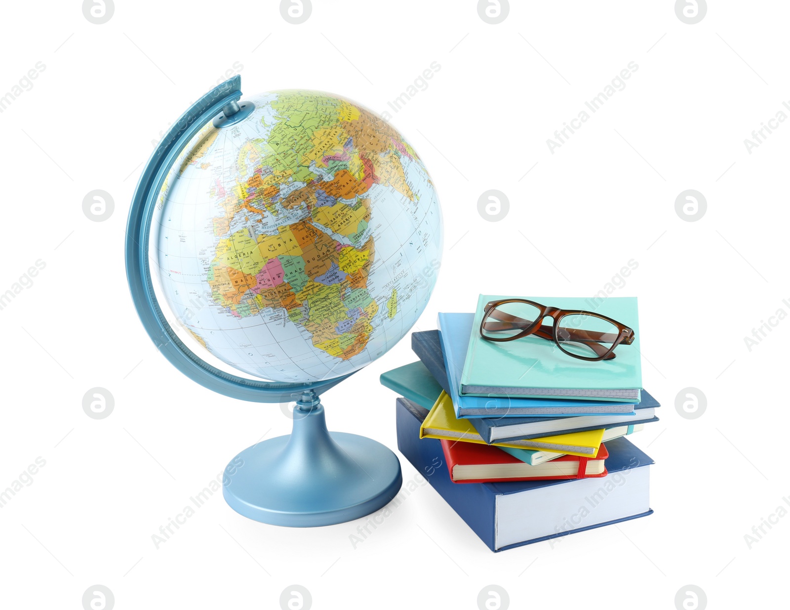 Photo of Plastic model globe of Earth, books and eyeglasses on white background. Geography lesson