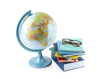 Plastic model globe of Earth, books and eyeglasses on white background. Geography lesson
