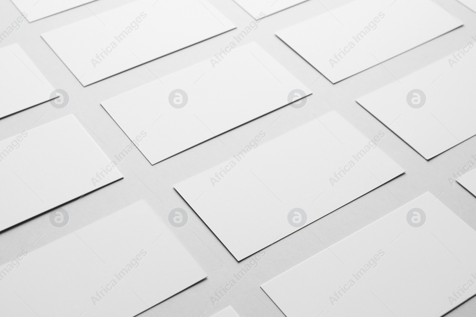 Photo of Blank business cards on light gray background, closeup. Mockup for design