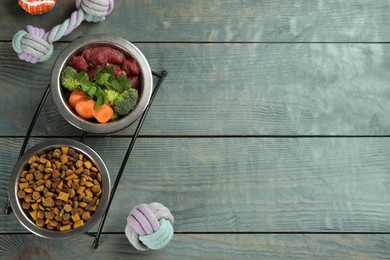 Photo of Natural pet food and toys on light blue wooden table, flat lay. Space for text