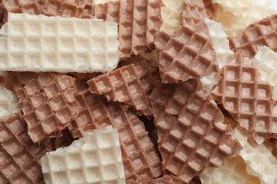 Photo of Tasty crumbled wafers as background, top view. Crispy food