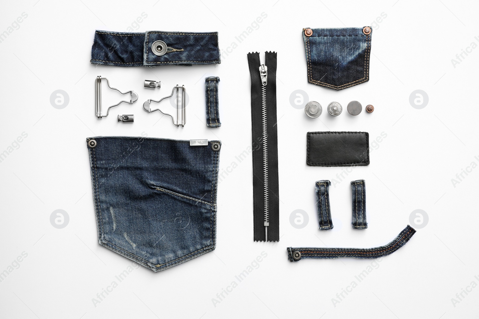 Photo of Composition with garment accessories and cutting details for jeans isolated on white, top view