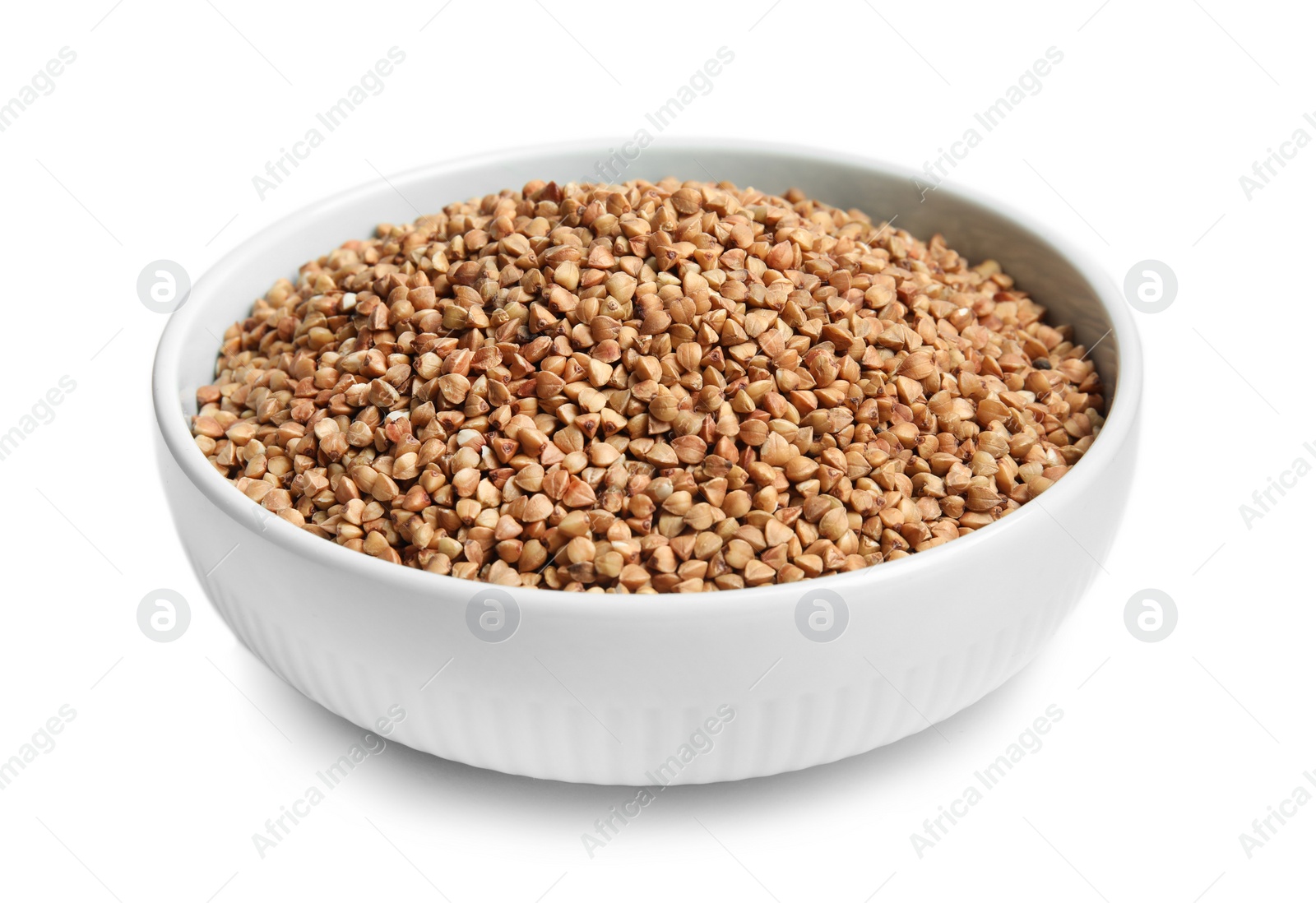 Photo of Bowl with uncooked buckwheat on white background