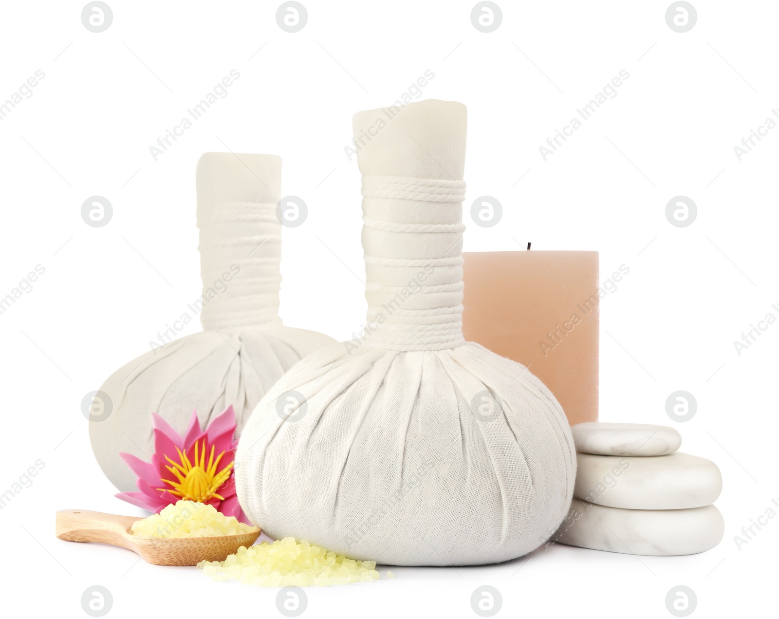 Photo of Herbal massage bags and other spa products on white background