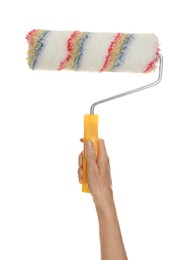 Woman holding paint roller brush on white background, closeup