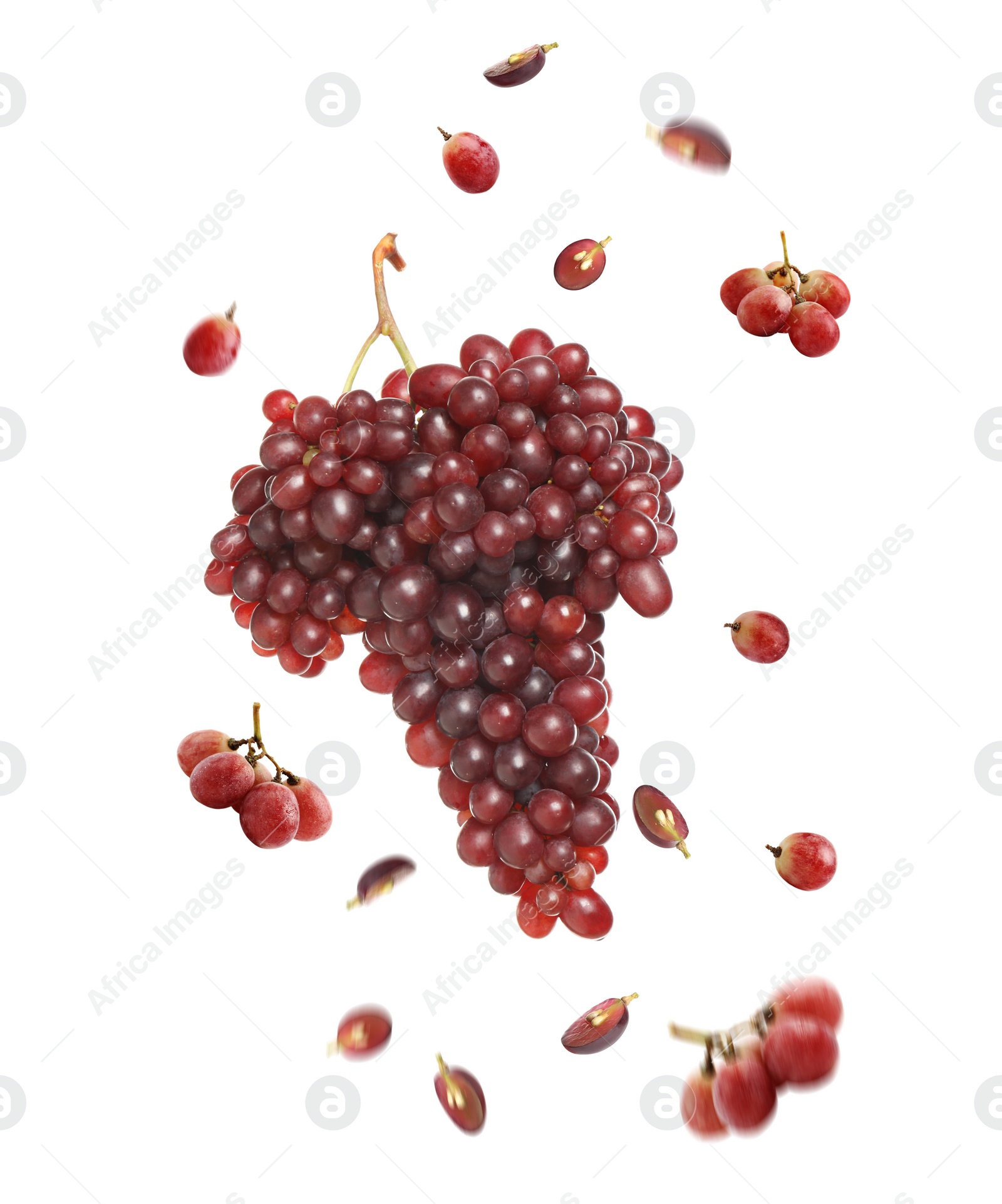 Image of Fresh ripe grapes falling on white background