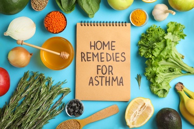 Photo of Natural products and notebook with text HOME REMEDIES FOR ASTHMA on color background, flat lay
