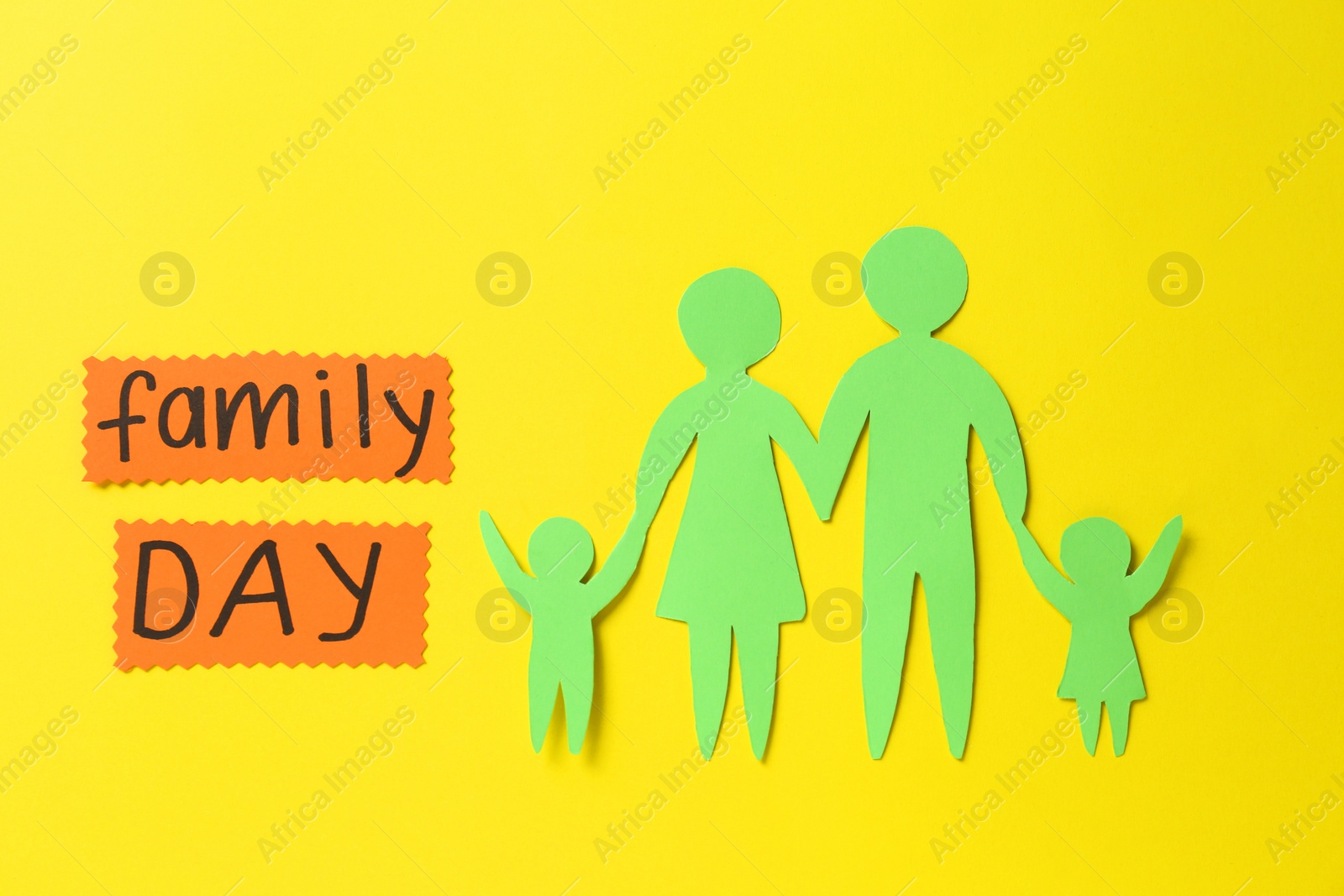 Photo of Cards with text Family Day and paper cutout on yellow background, flat lay
