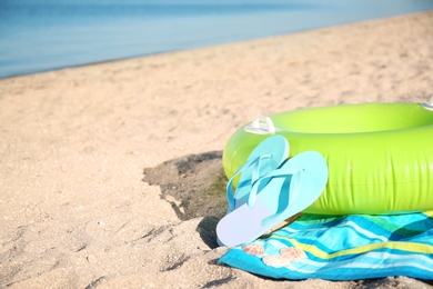 Beach objects on sand near sea. Space for text