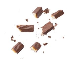 Image of Pieces of chocolate bars falling on white background