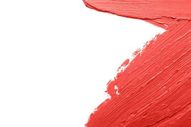 Red lipstick smears on white background, closeup. Space for text