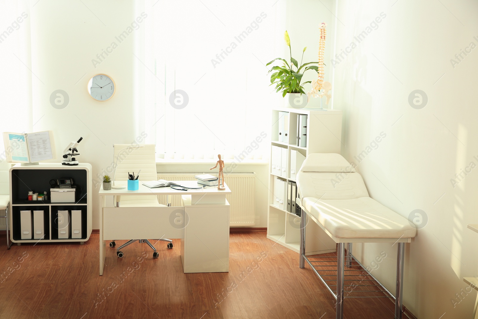 Photo of Interior of modern medical office. Doctor's workplace