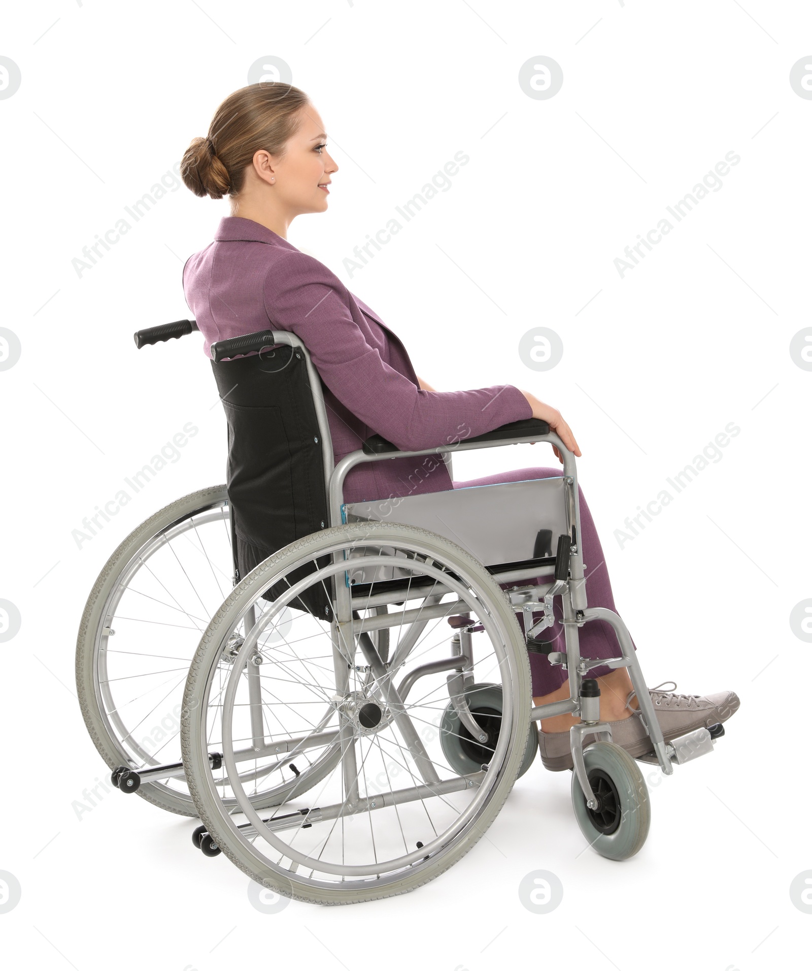 Photo of Beautiful young businesswoman in wheelchair isolated on white