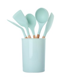 Photo of Set of turquoise kitchen utensils in holder isolated on white