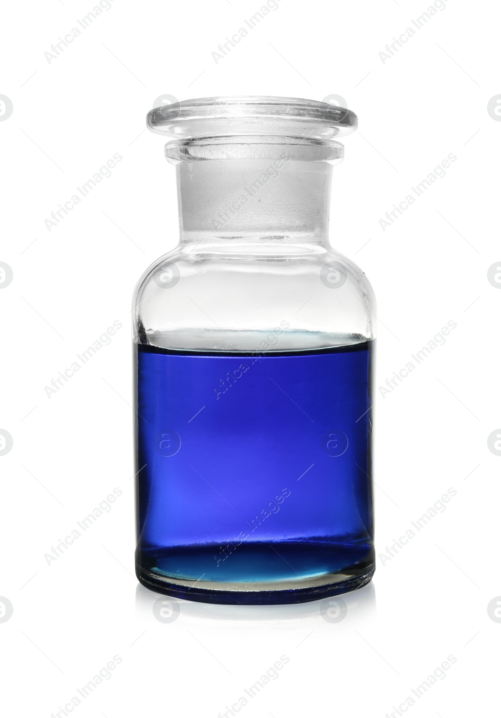 Photo of Bottle with color liquid isolated on white. Solution chemistry