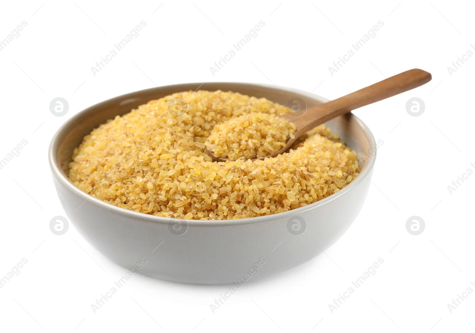 Photo of Bowl and spoon with raw bulgur isolated on white