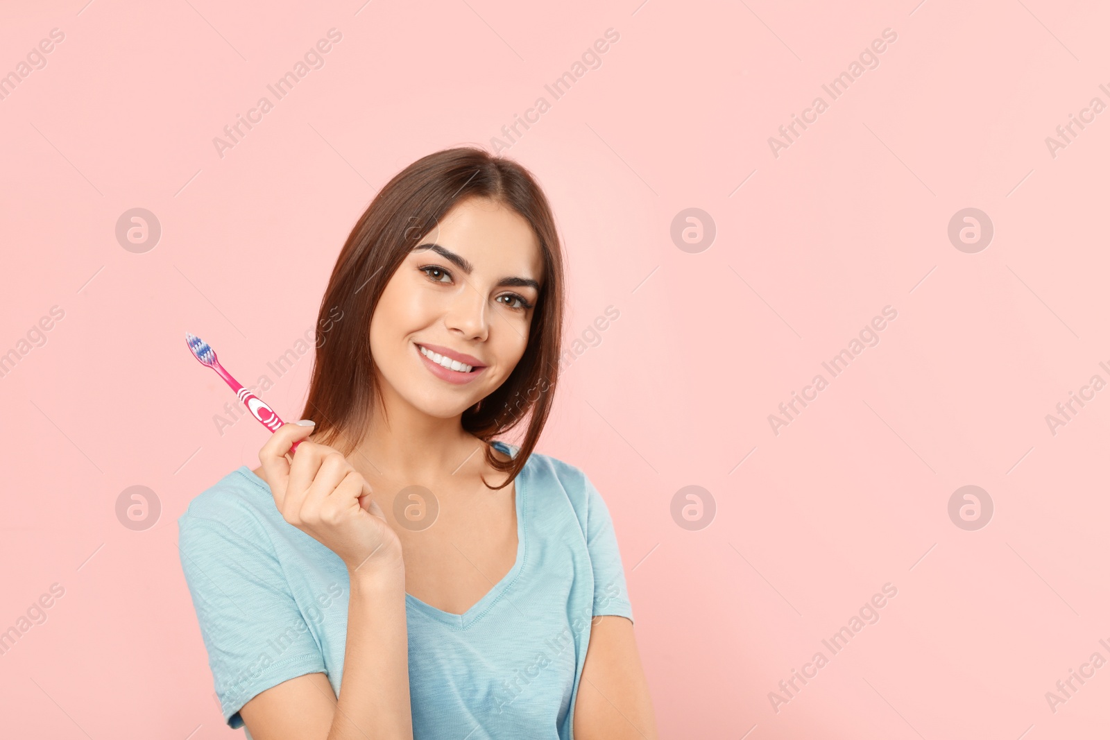 Photo of Beautiful woman with toothbrush on color background. Teeth care