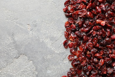 Photo of Cranberries on color background, top view with space for text. Dried fruit as healthy snack