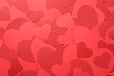 Photo of Red paper hearts as background, top view
