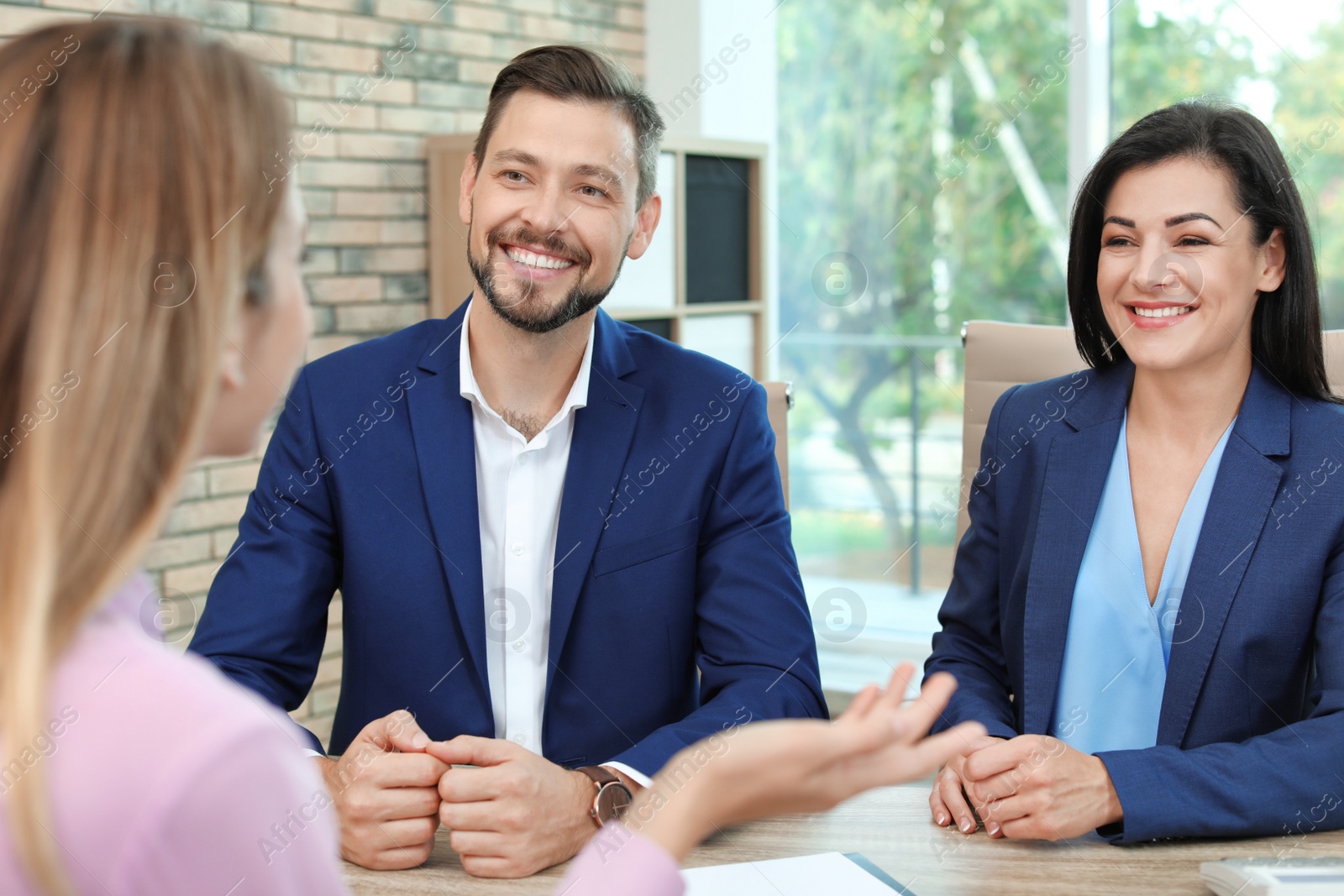 Photo of Human resources commission conducting job interview with applicant in office