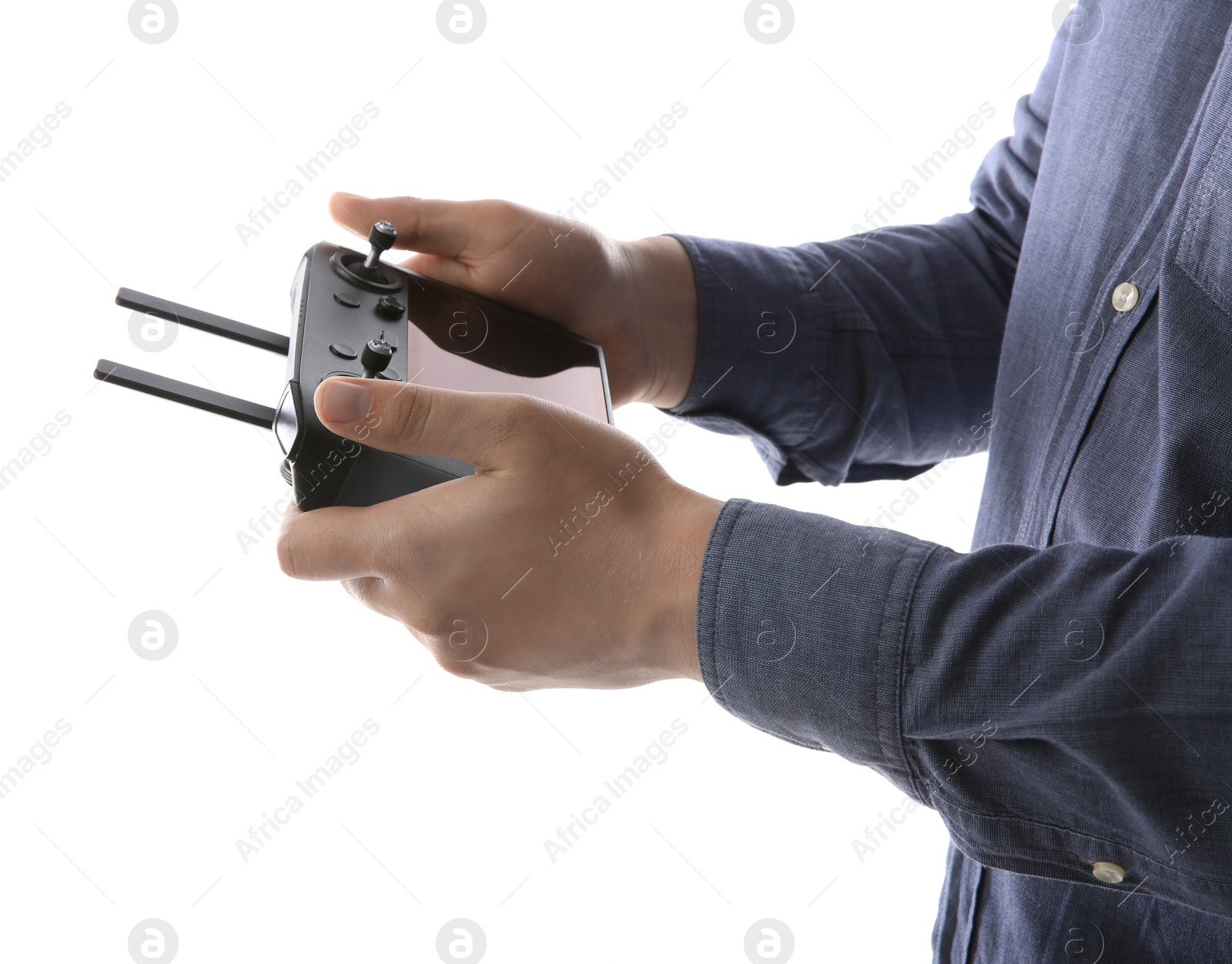 Photo of Man holding new modern drone controller on white background, closeup of hands