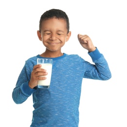 Adorable African-American boy with glass of milk on white background
