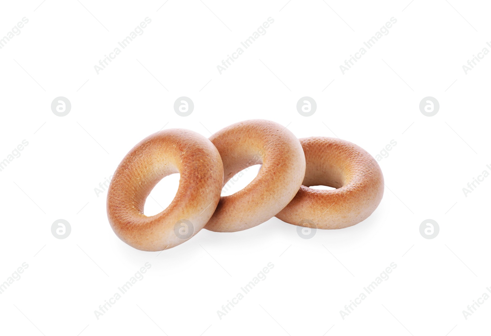 Photo of Tasty dry bagels (sushki) on white background