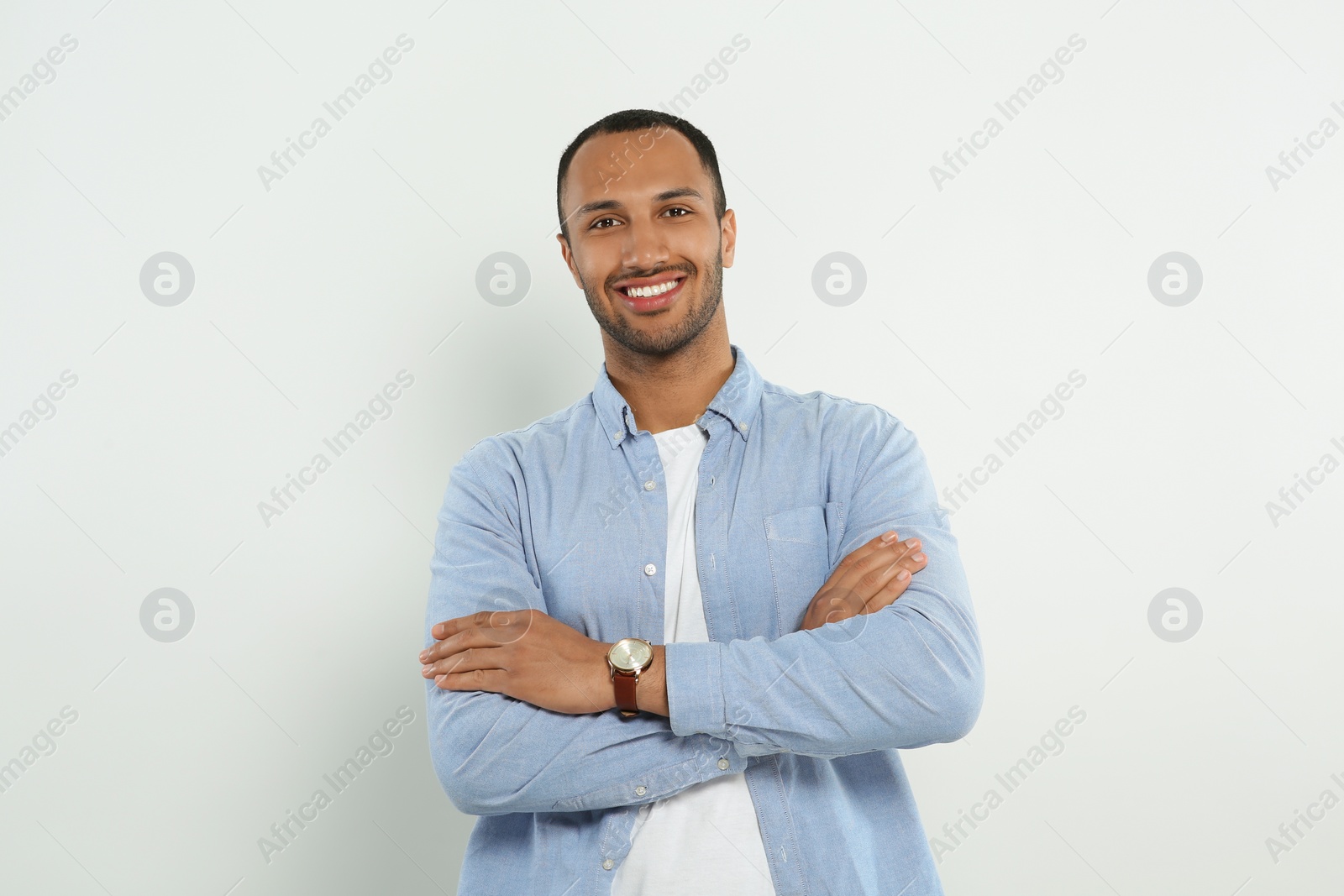 Photo of Portrait of handsome young man on white background