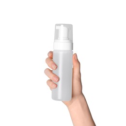 Photo of Woman holding bottle of face cleansing product on white background, closeup