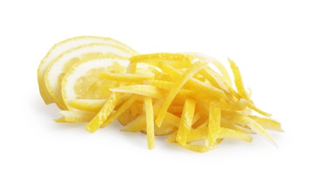 Photo of Pieces of lemon peel and slices of fresh fruit on white background. Citrus zest