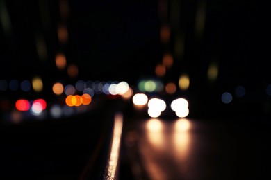 Photo of Blurred view of city lights at night. Bokeh effect