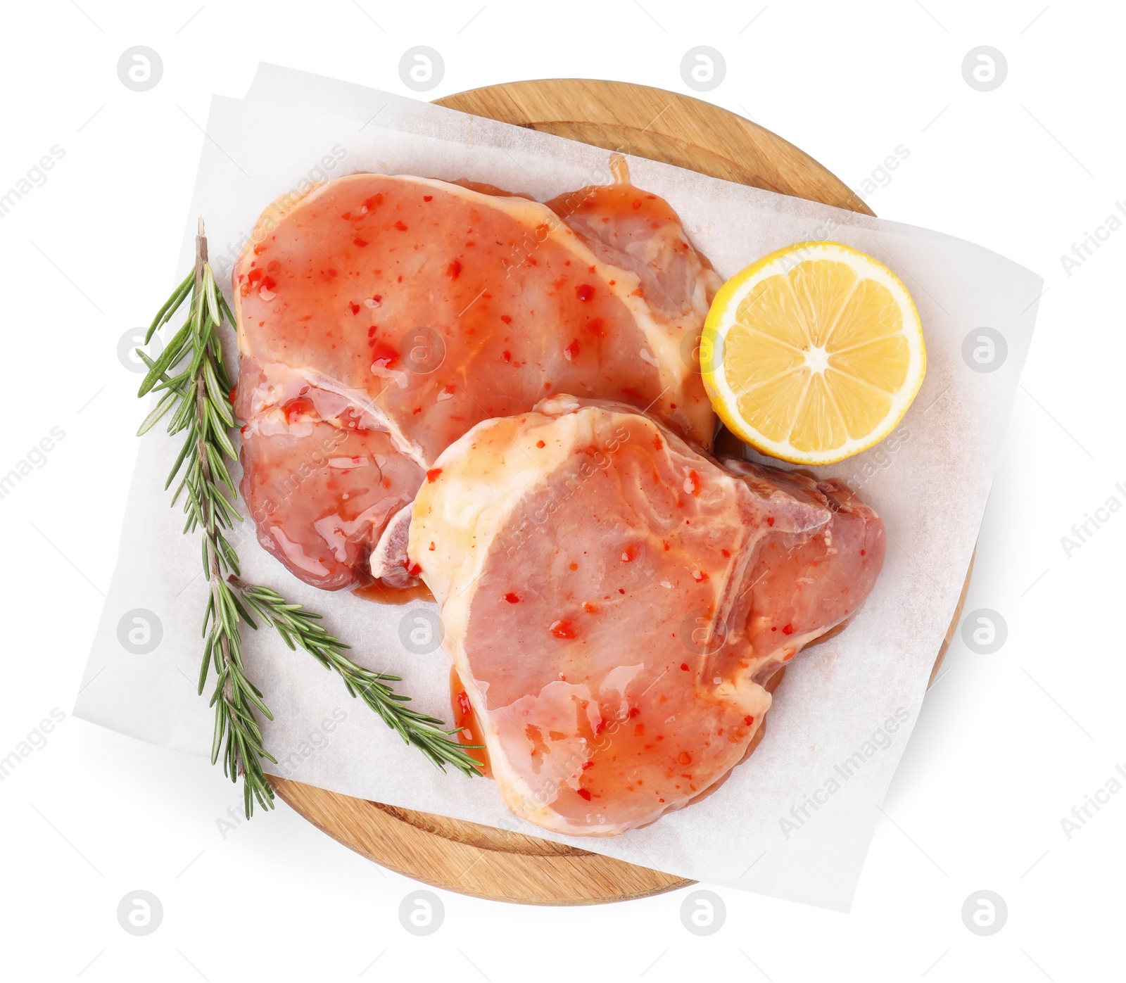 Photo of Board with raw marinated meat, lemon and rosemary isolated on white, top view