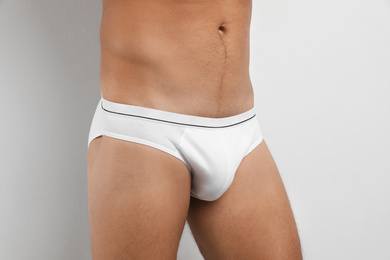 Photo of Man in underwear on white background, closeup