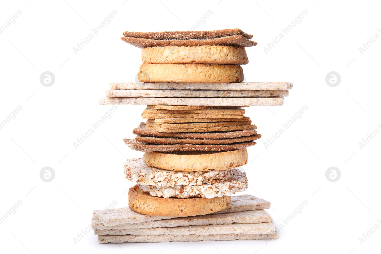 Photo of Stack of fresh rye crispbreads, crunchy rice cakes and rusks on white background