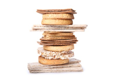 Photo of Stack of fresh rye crispbreads, crunchy rice cakes and rusks on white background