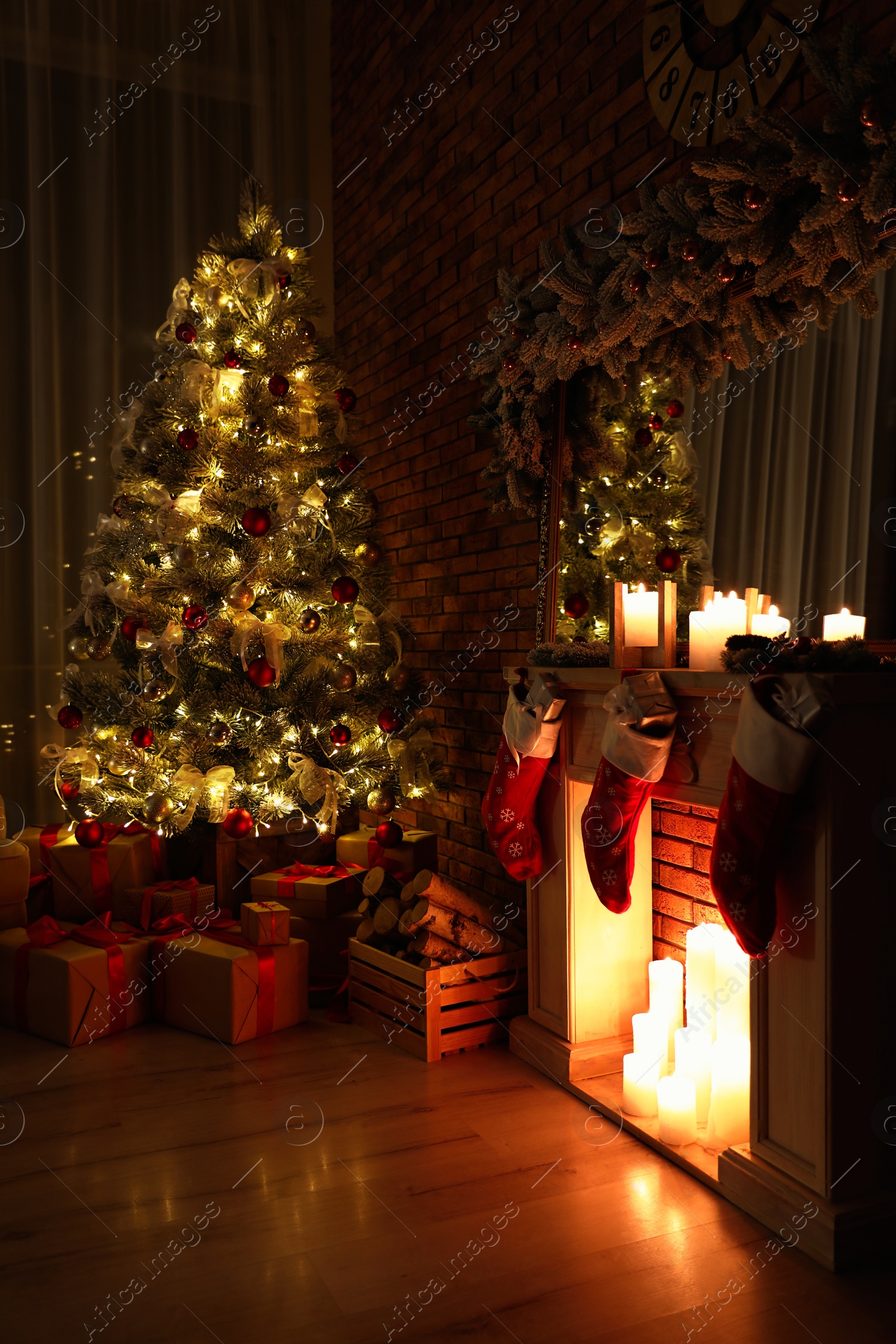 Photo of Stylish room interior with beautiful Christmas tree in evening