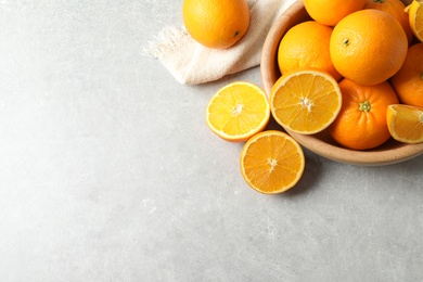 Flat lay composition with ripe oranges and space for text on light background