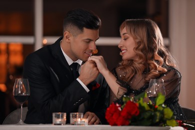 Photo of Lovely couple having romantic dinner on Valentine's day in restaurant