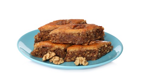 Plate of delicious honey baklava with walnuts on white background