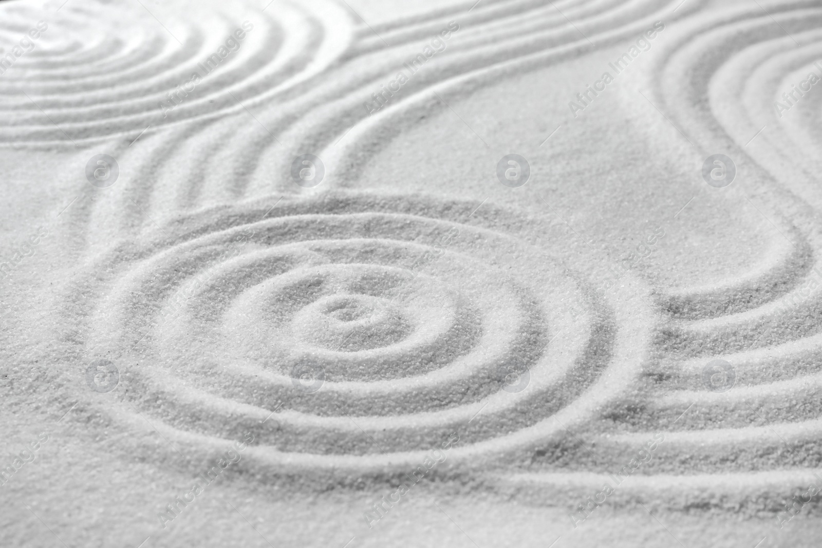 Photo of White sand with pattern as background. Zen, meditation, harmony