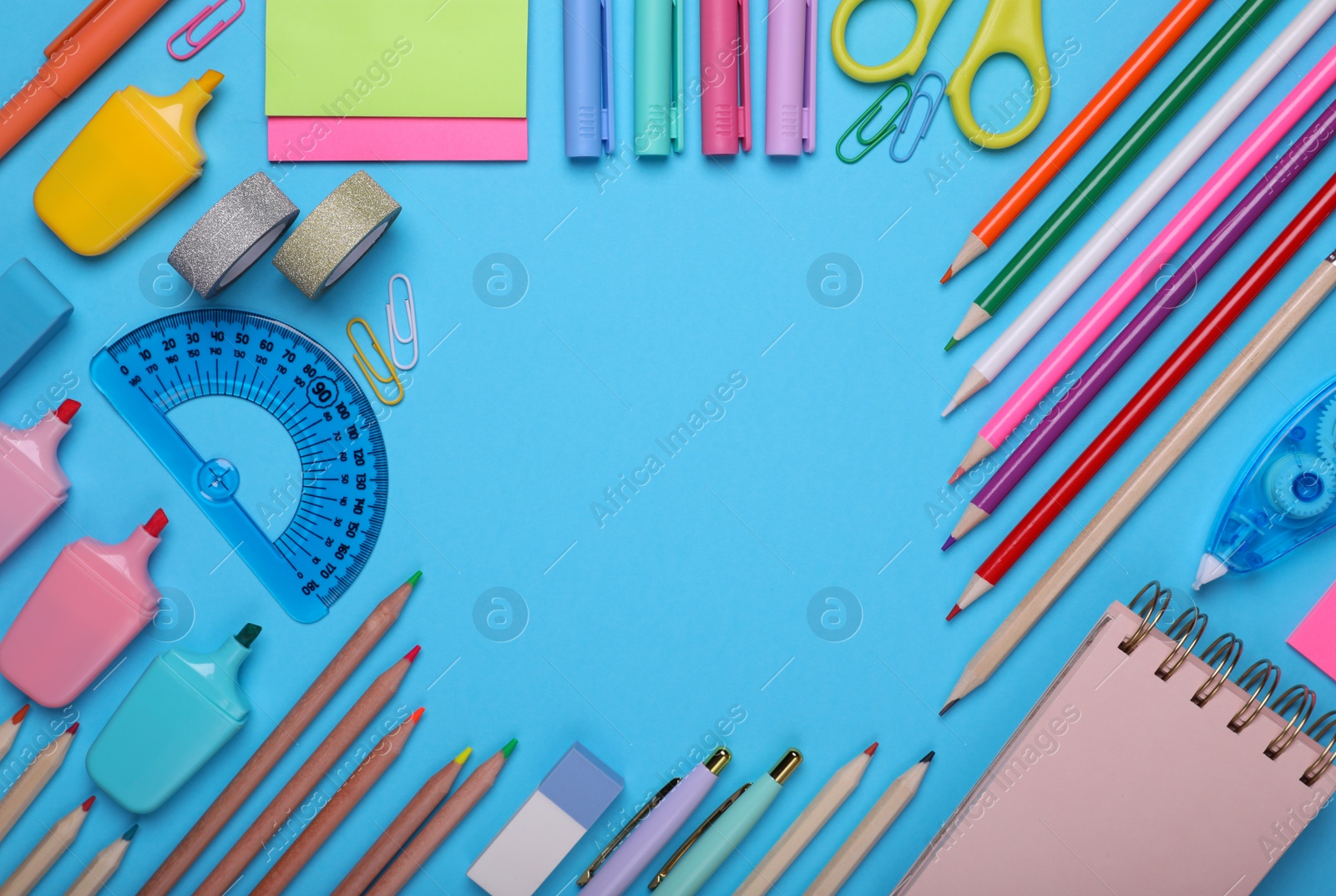 Photo of Back to school. Frame of different school stationery on light blue background, flat lay. Space for text