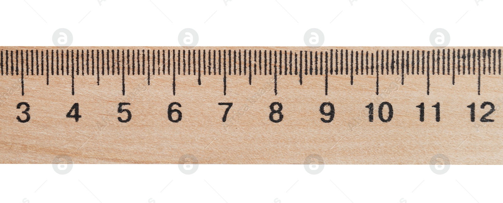 Photo of Wooden ruler with measuring length markings in centimeters isolated on white, top view