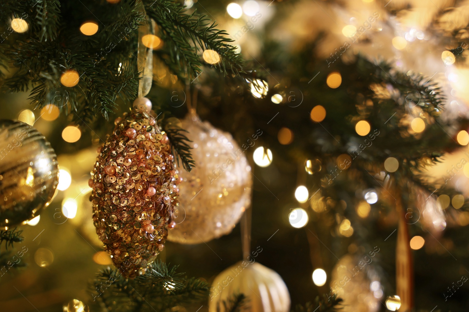 Photo of Closeup view of Christmas tree with beautiful decor