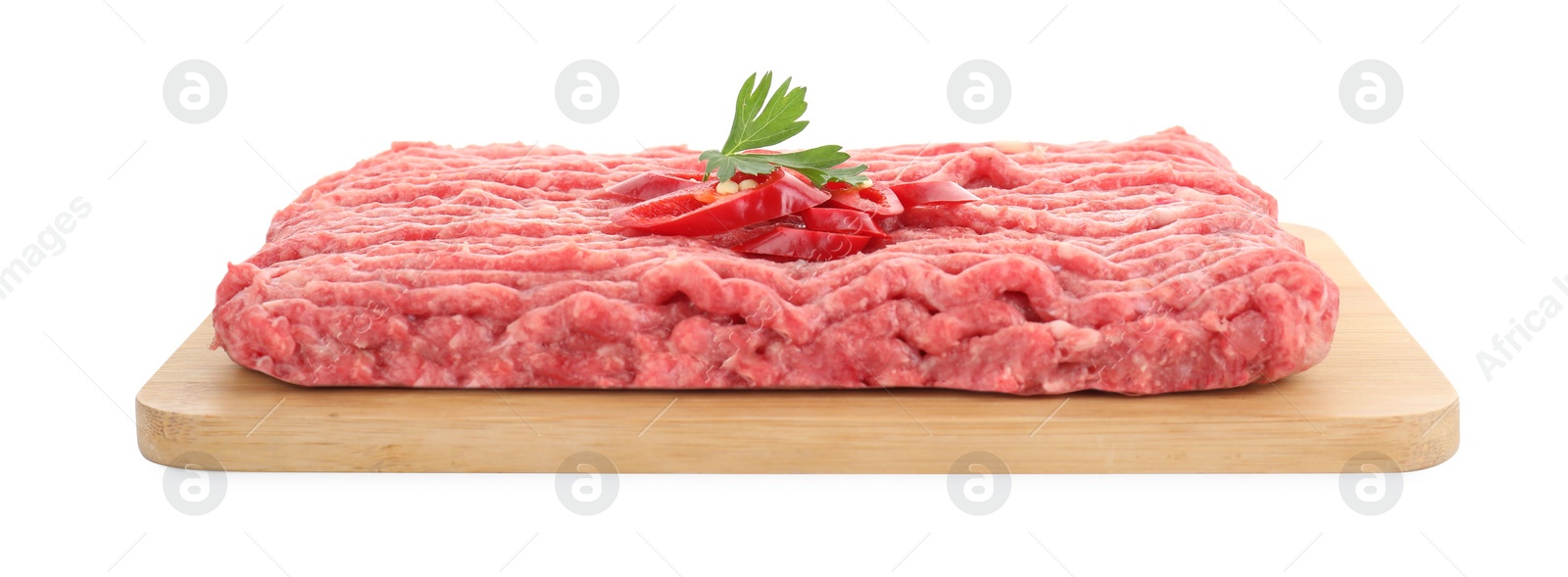 Photo of Board with raw ground meat, chili pepper and parsley isolated on white