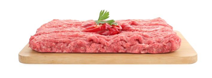 Photo of Board with raw ground meat, chili pepper and parsley isolated on white