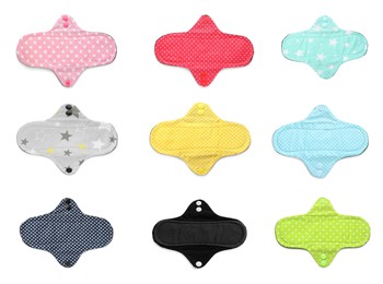 Set with different cloth menstrual pads on white background, top view